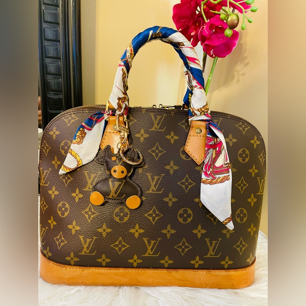 Louis Vuitton Alma Monogram Handbag